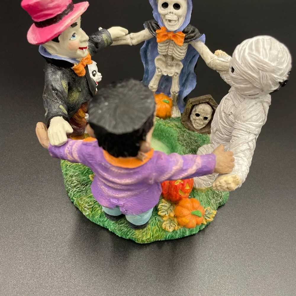 Halloween 5”w x  4”h Holding Hands Resin Circular Candle